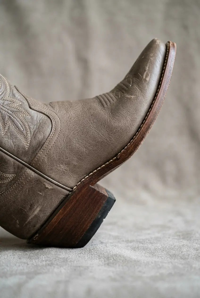 Side view of taupe wide-calf western boots