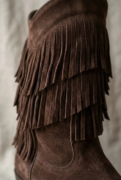 Side view of chocolate wide-calf fringe boots