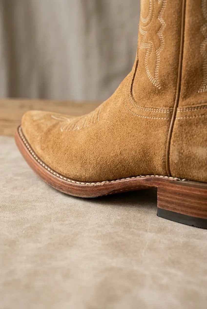 Side view of dark brown wide-calf fringe boots