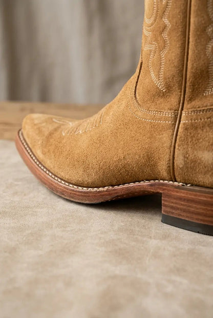 Side view of dark brown wide-calf fringe boots