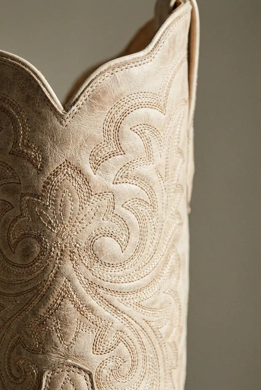 Side view of ivory wide-calf western boots