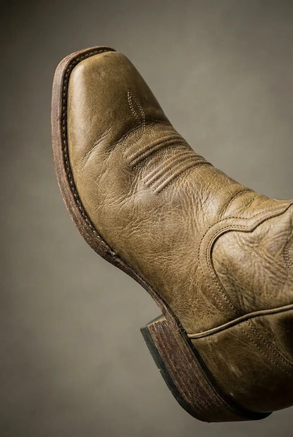 Side view of khaki wide-calf knee-high boots